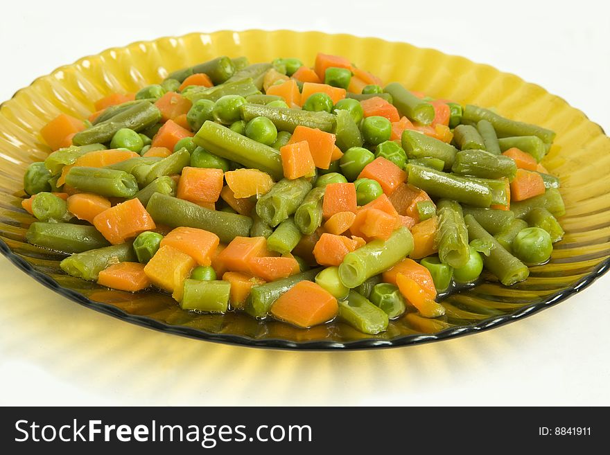 The prepared vegetables on a wavy glass plate
