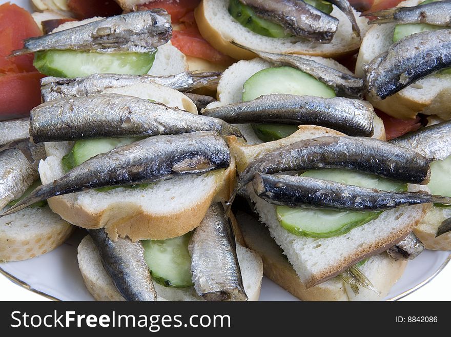 Sandwiches with smoked fish and a cucumber