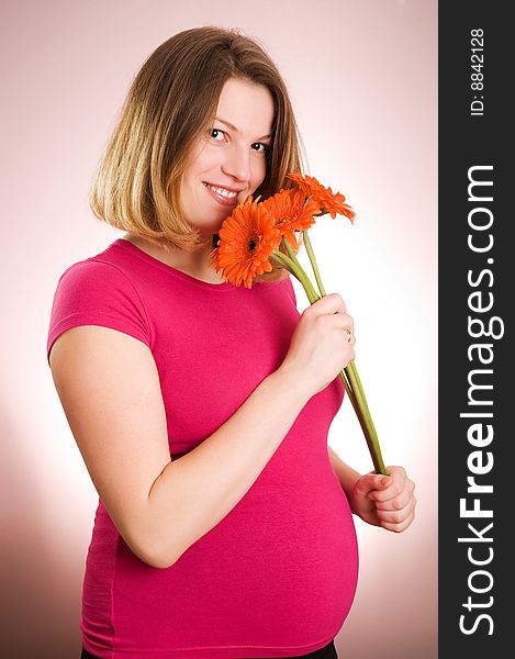 Portrait of joyful young beautiful pregnant woman