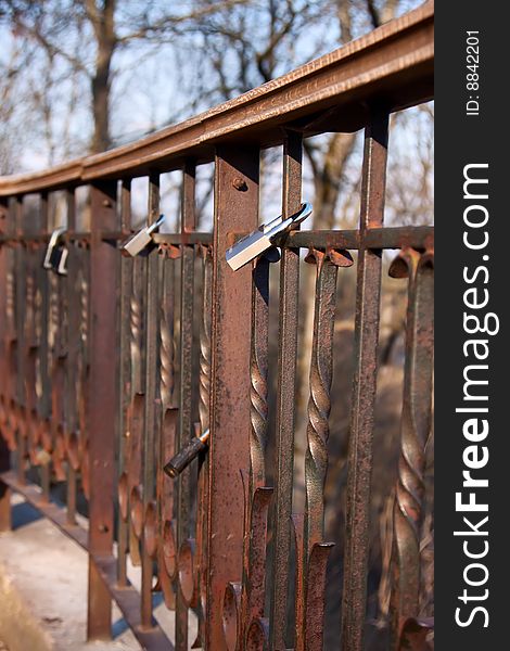 Padlocks on bridge left by people in love on their wedding day. Lithuania. Padlocks on bridge left by people in love on their wedding day. Lithuania