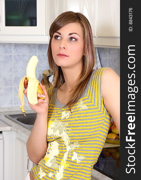 Young woman cooking in her kitchen. Young woman cooking in her kitchen