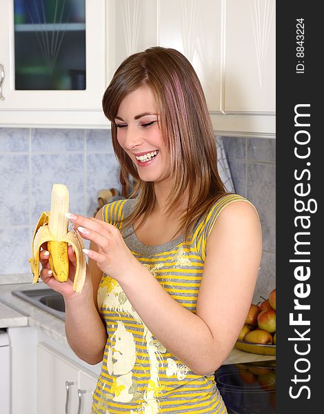 Young woman cooking in her kitchen. Young woman cooking in her kitchen