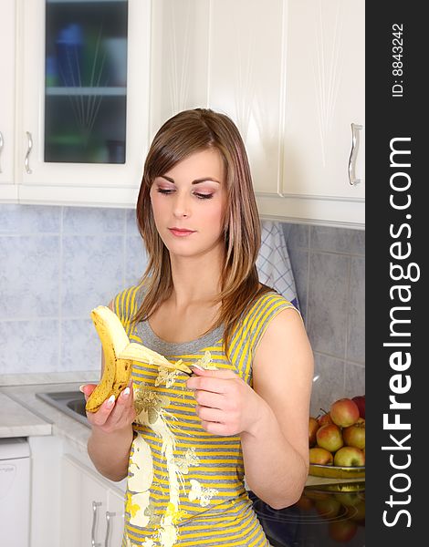 Young woman cooking in her kitchen. Young woman cooking in her kitchen