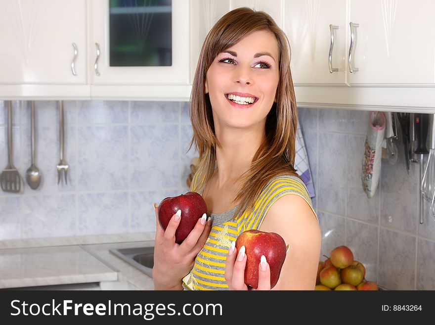 Young woman cooking in her kitchen. Young woman cooking in her kitchen