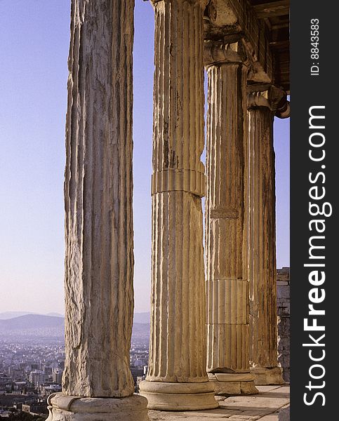 Old columns of Erechteion Temple on Acropolis hill in Athens, Greece. Old columns of Erechteion Temple on Acropolis hill in Athens, Greece.