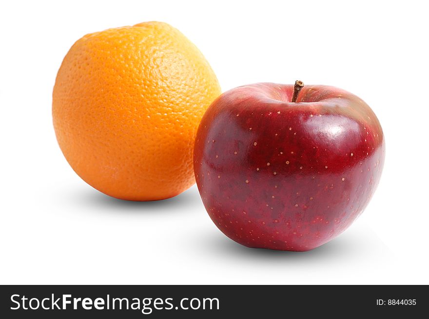 Orange and red apple. Isolated on white. Orange and red apple. Isolated on white.