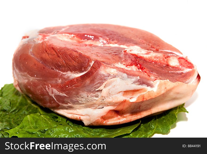 Red Meat on a white background with lettuce