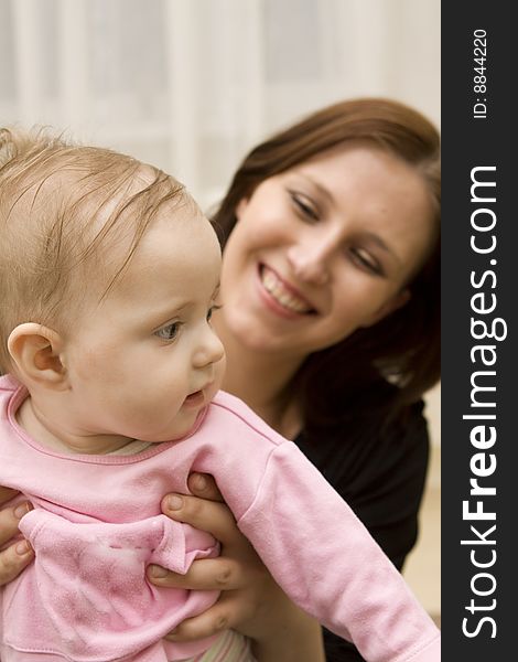 Mother And Baby Playing In Home