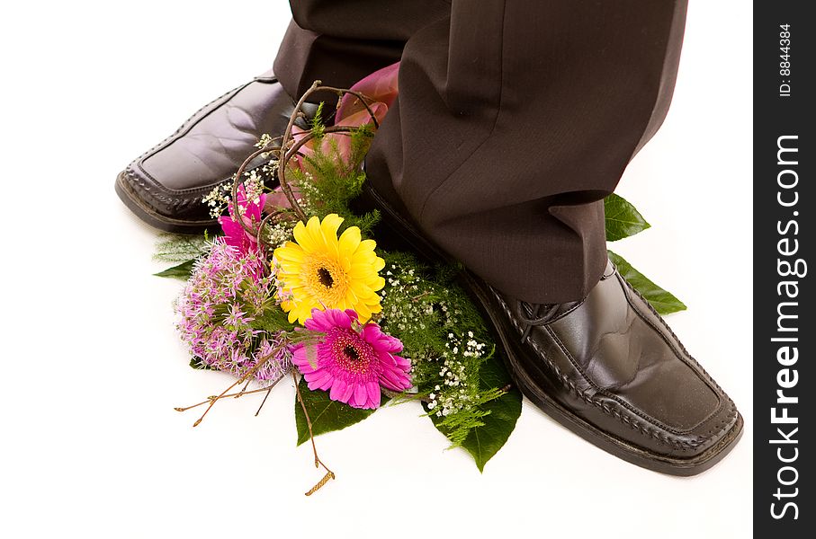 Man treads flowers on white. Man treads flowers on white