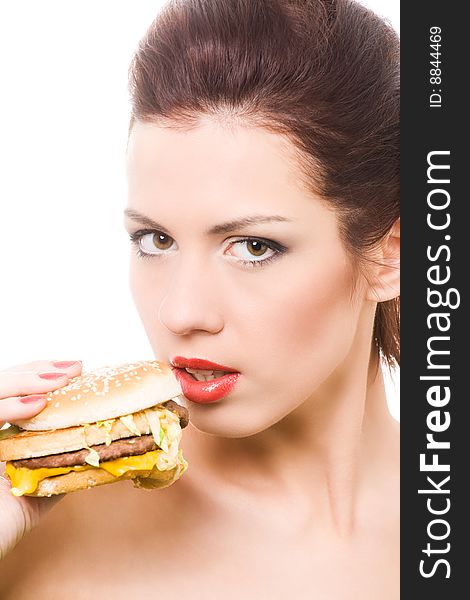 Close-up portrait of young woman with hamburger. Close-up portrait of young woman with hamburger