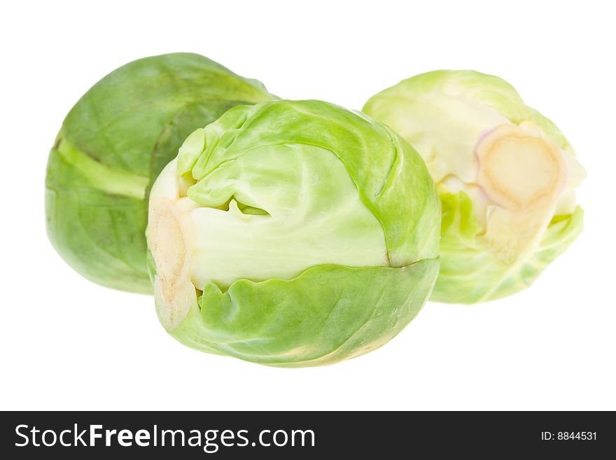 Three brussels sprouts, isolated on white