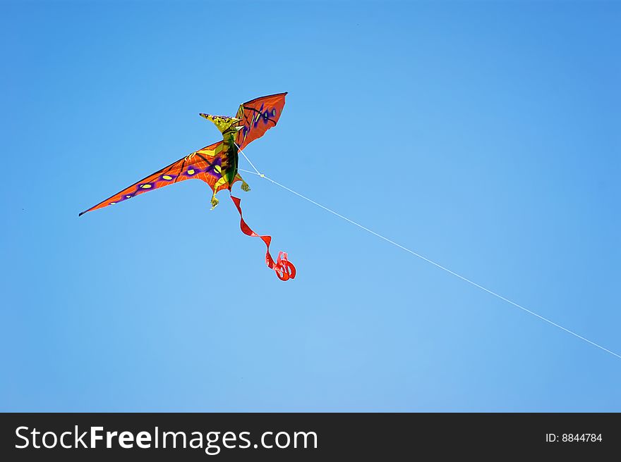 Pterdondon dinosaur kite flying on a clear day