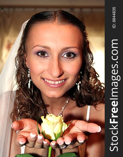 Young beautiful bride with rose