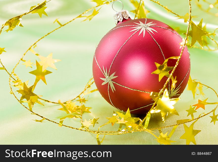 Holiday series:  Christmas ball and the golden garland. Holiday series:  Christmas ball and the golden garland