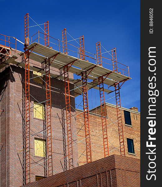 New building being built and detail of construction site. New building being built and detail of construction site