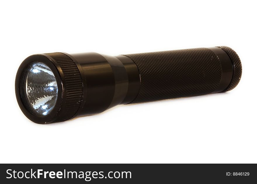 A flashlight isolated on a white background. A flashlight isolated on a white background.