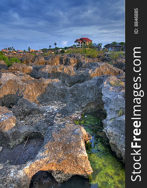 This rocky terrain is located in Barangay Babag, Lapu-lapu City, Cebu, Philippines. This HDR was taken during sunset.