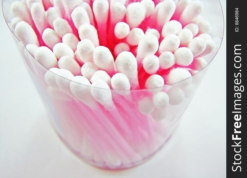 A cotton swabs pot. With pink stick.