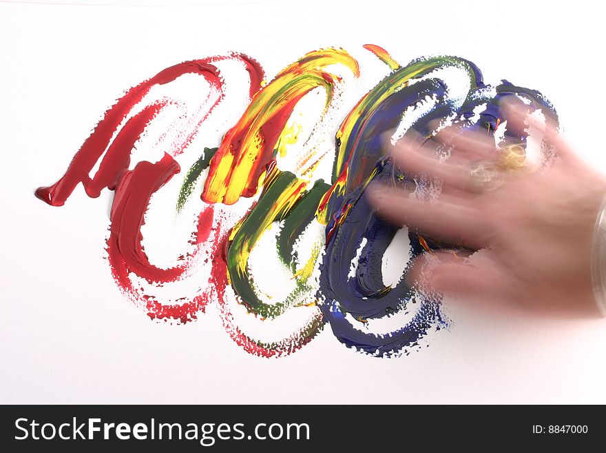 Bold primary colors being fingerpainted, and the dynamic hand that is doing the painting. Bold primary colors being fingerpainted, and the dynamic hand that is doing the painting