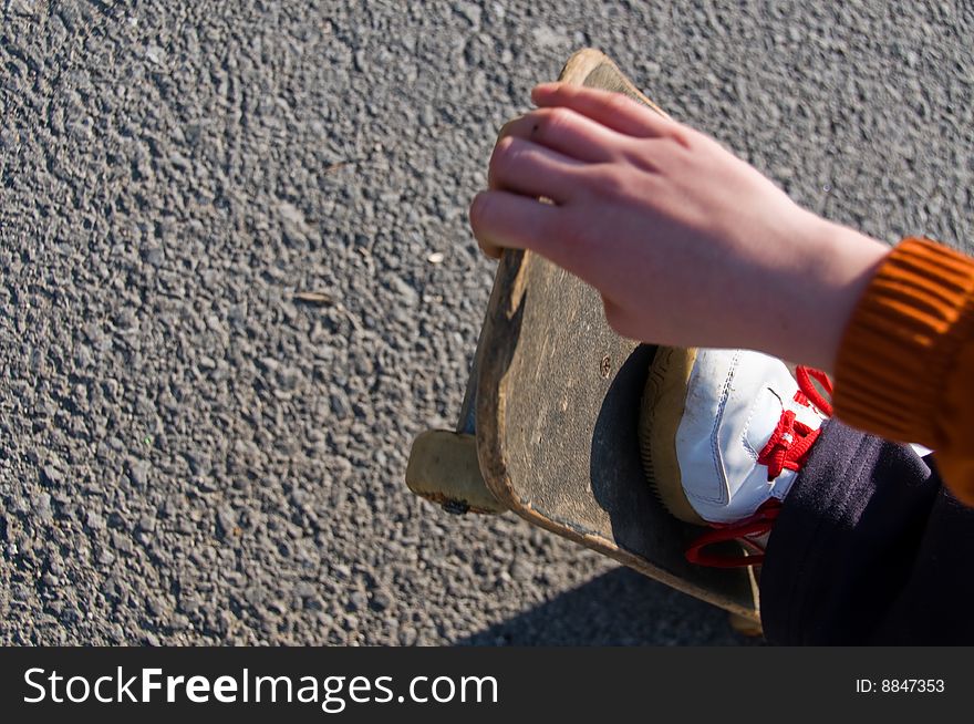 A young teen skateboarding and having fun in a suburban setting. A young teen skateboarding and having fun in a suburban setting.