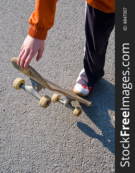 A young teen skateboarding and having fun in a suburban setting. A young teen skateboarding and having fun in a suburban setting.