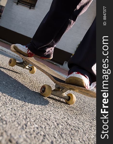 A young teen skateboarding and having fun in a suburban setting. A young teen skateboarding and having fun in a suburban setting.