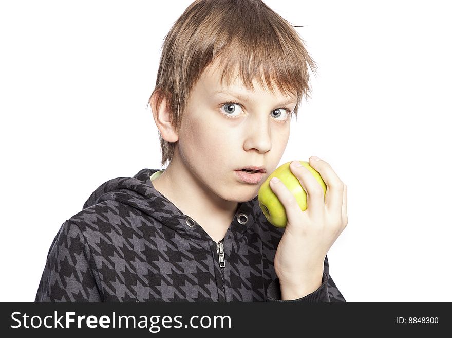 Isolated boy eating apple over white background. Isolated boy eating apple over white background