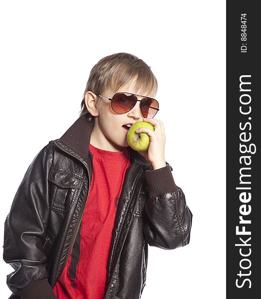 Isolated boy eating apple over white background. Isolated boy eating apple over white background