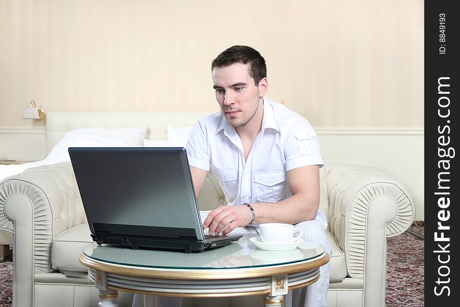 Attractive young man with laptop. Attractive young man with laptop