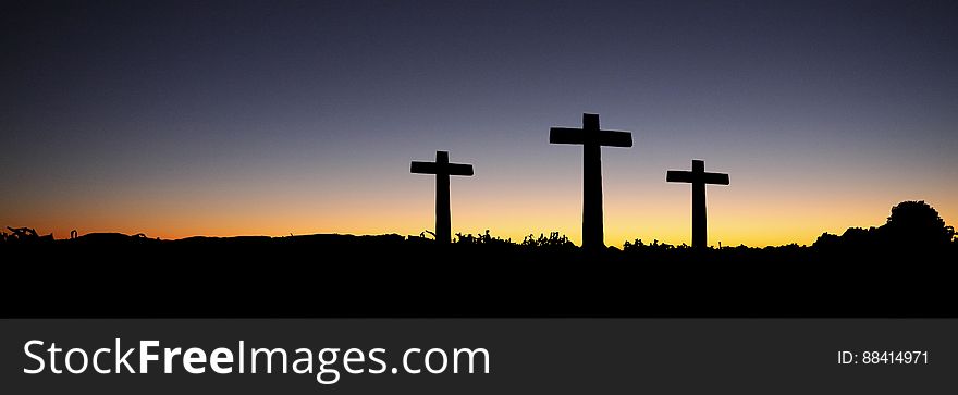 Landscape View Of 3 Cross Standing During Sunset