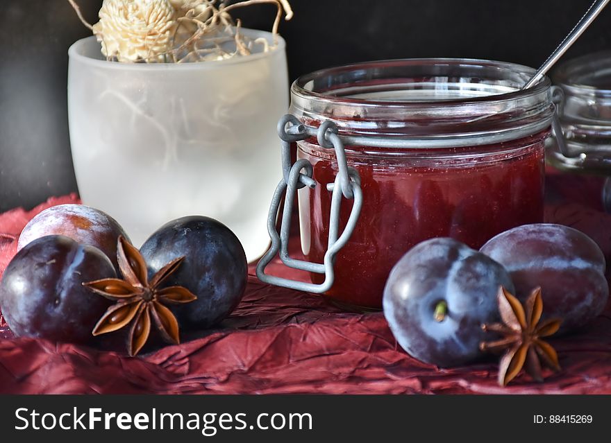 Round Fruit Near Mason Glass Jar