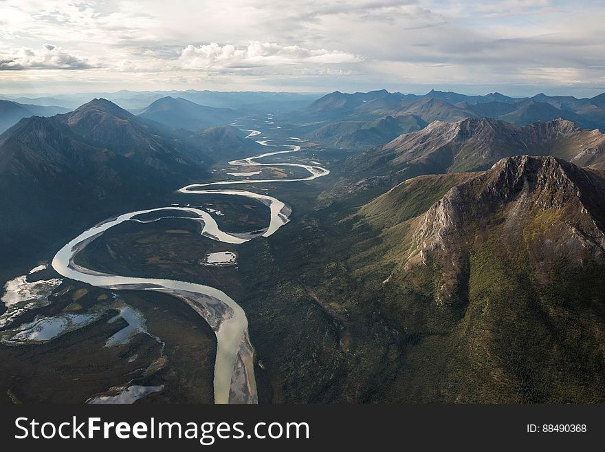 Green Mountains and Flowing River