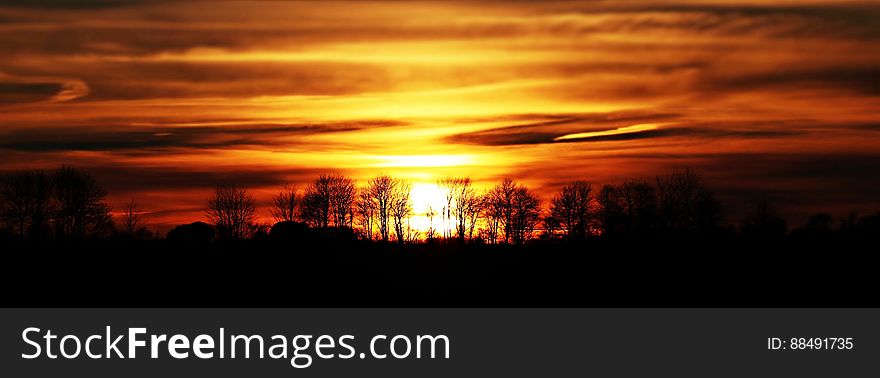 Scenic View of Silhouette Landscape Against Sunset Sky