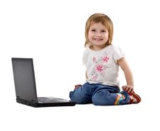 Little Girl Sit Near Laptop Royalty Free Stock Photos
