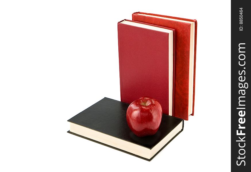 A red apple on  book