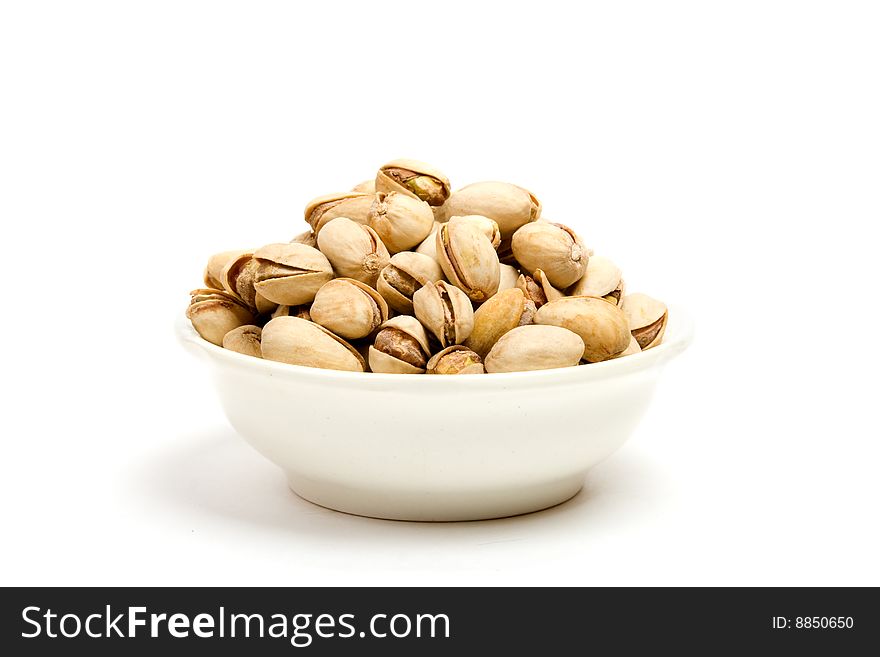 Pistachios with shell on white background