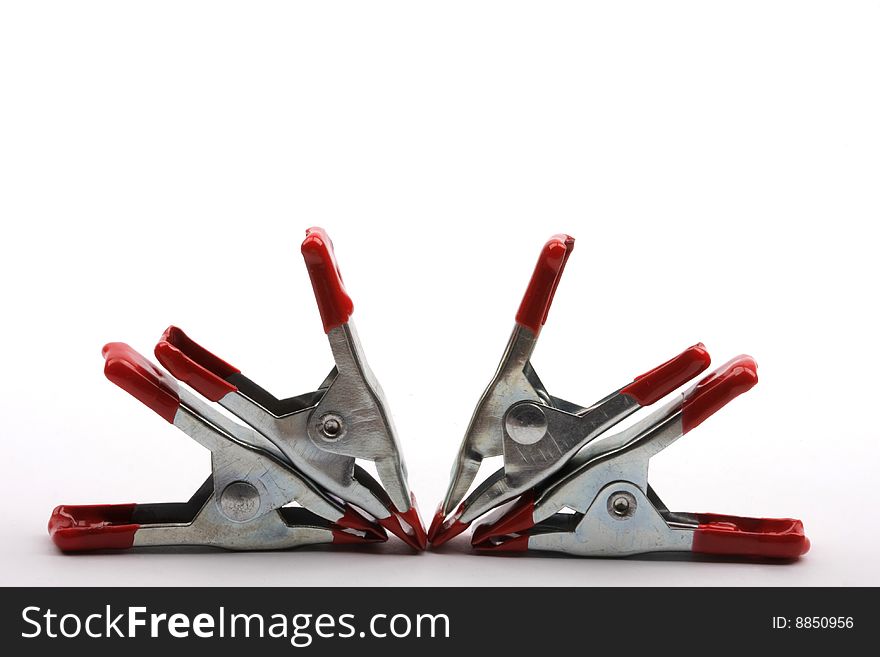 Four red color clamps background