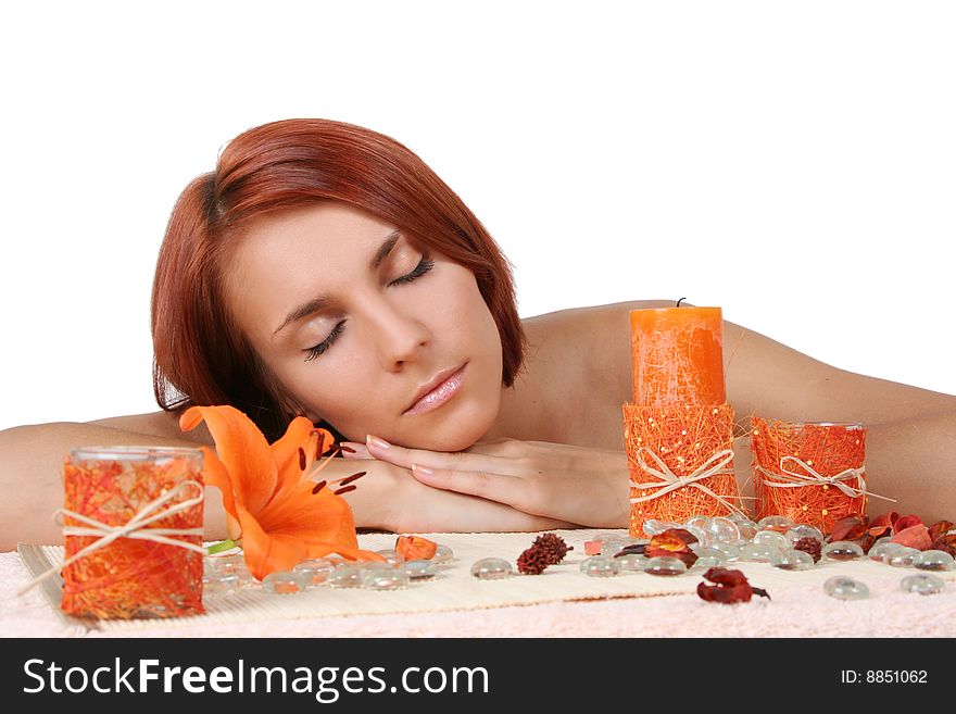 Beautiful girl relaxing in spa salon