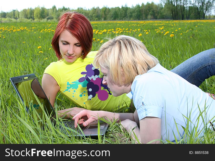 Happy young girls relaxing outdoors. Happy young girls relaxing outdoors