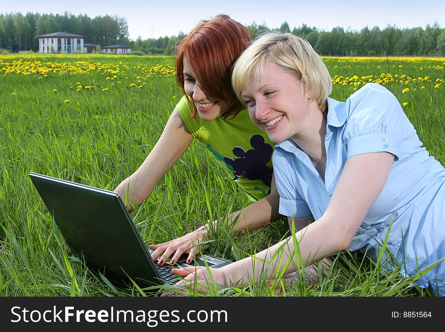 Happy young girls relaxing outdoors. Happy young girls relaxing outdoors