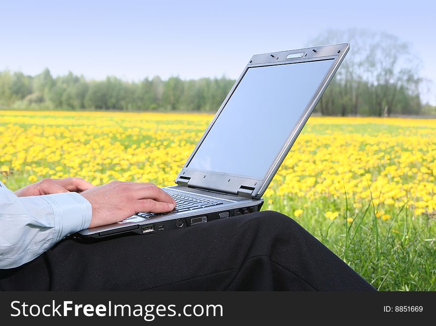 Young man with laptop outdoors. Young man with laptop outdoors