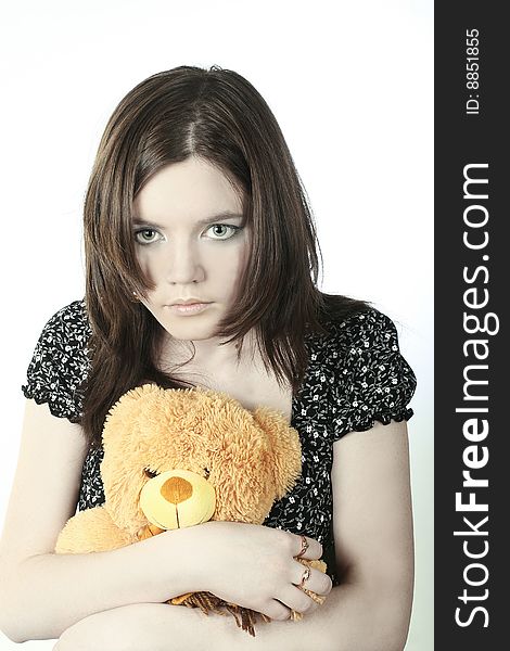 Romantic portrait of teen-girl with bear in her hands. Romantic portrait of teen-girl with bear in her hands.