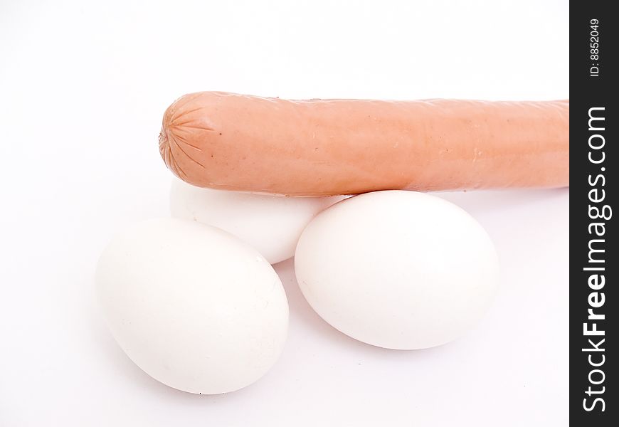 Sausage and eggs 	
isolated on white background