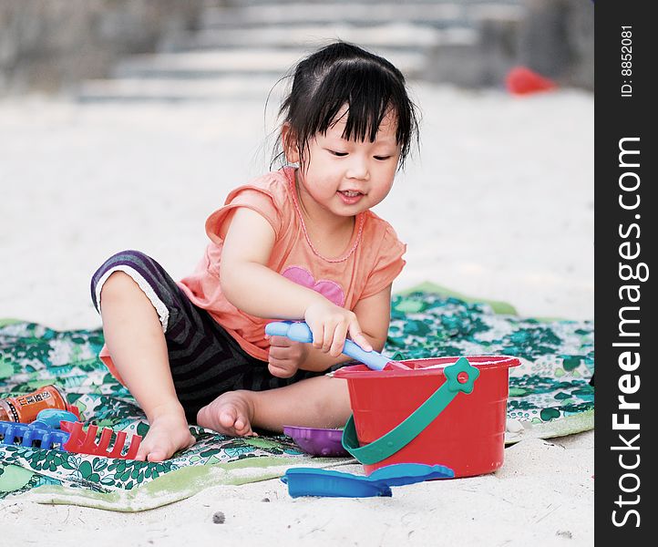 Asian Child On The Beach