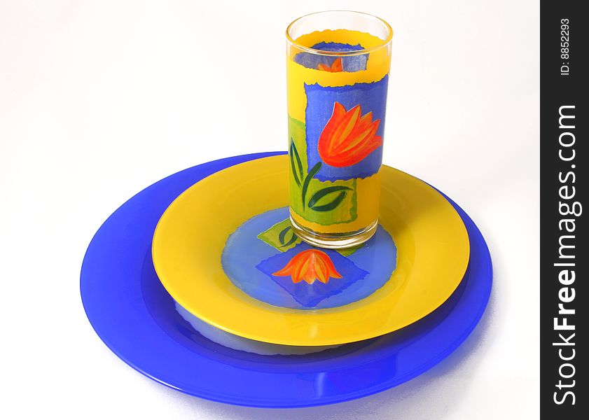 Two plates and glass - a set for a breakfast. Two plates and glass - a set for a breakfast