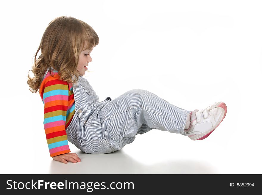 Beauty a little girl crawled on white background