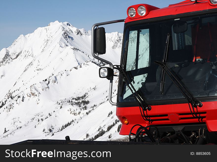 A snow-cat and mountain in winter