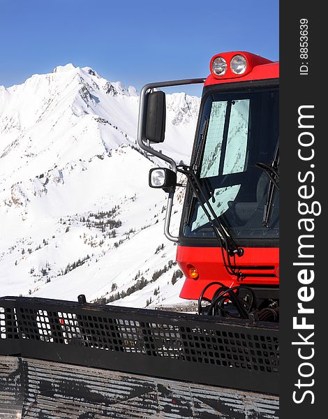 A snow-cat and mountain in winter vertical