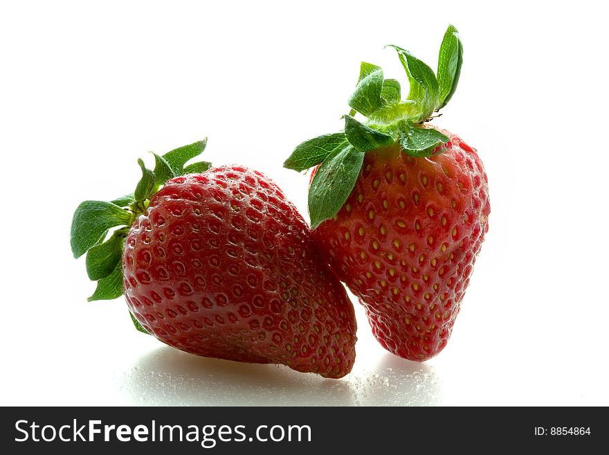 Two strawberries on a white background. Two strawberries on a white background