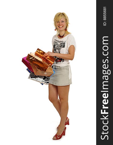 Full body view of young attractive woman going shopping with lots of colorful shopping bags. Isolated on white background. Full body view of young attractive woman going shopping with lots of colorful shopping bags. Isolated on white background.